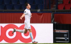 Florian Thauvin celebrates after scoring for Marseille against Paris Saint-Germain in 2020