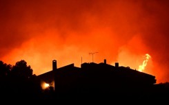 Over 200 firefighters had battled to keep the fire from threatening the coastal resorts dotting the coast of Attica