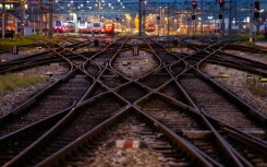 Austria's state railway says a man has survived clinging to the outside of a moving Austrian high-speed train en route from Zurich to Vienna -- reportedly after it left the station whilst he was having a cigarette