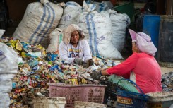 Women sorting through plastic waste in Pekanbaru, Indonesia