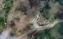 This satellite image from Maxar Technologies shows the destruction from the flood and landslides in Dharali