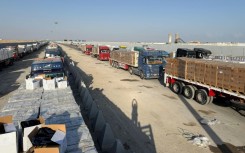 Long lines of aid trucks wait on the Egyptian side of the Gaza border for Israeli permission to enter the Palestinian territory.