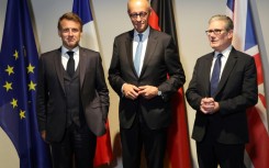 France's President Emmanuel Macron (L), Germany's Chancellor Friedrich Merz and Britain's Prime Minister Keir Starmer are due to hold a video call on Ukraine