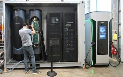 An engineer works on a flywheel energy storage system at Levistor's workshop in southwest London