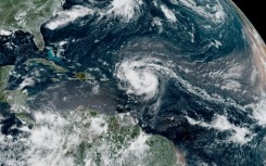 This satellite image provided by the National Oceanic and Atmospheric Administration shows Hurricane Erin forming in the Atlantic Ocean