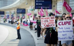 Striking Air Canada workers walk the picket line at Pearson International Airport in Toronto