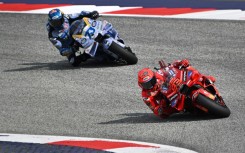 Marc Marquez (R) leads his brother Alex Marquez on his way to victory in the sprint at the Austrian MotoGP