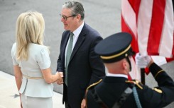 British Prime Minister Keir Starmer is greeted by US Chief of Protocol Monica Crowley (L) upon arrival at the White House South Portico in Washington, DC, on August 18, 2025