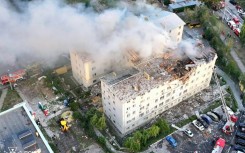 The attack reduced part of the building in Kharkiv to rubble