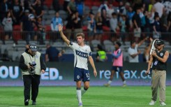 Thomas Mueller salutes fans after making his Major League Soccer debut for Vancouver Whitecaps in a 1-1 draw with Houston Dynamo