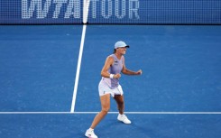 Iga Swiatek celebrates after defeating Jasmine Paolini to win the Cincinnati Open