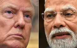 Indian Prime Minister Narendra Modi (R) is slashing consumption taxes as his economy braces for painful US tariffs levied by President Donald Trump