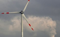A wind turbine and a lignite-fired power plant near Neurath, western Germany