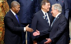 Angolan President Joao Lourenco (L) greets UN Secretary-General Antonio Guterres (R) during the 9th Tokyo International Conference on African Development in Japan
