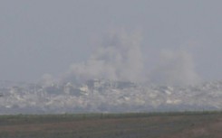 Israeli troops on Gaza border and smoke billows as Gaza City assault begins