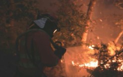 Spanish firefighters battling the fires in Galicia on August 19