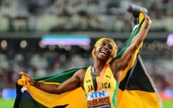 Jamaica's Shelly-Ann Fraser-Pryce celebrates after finishing third in the 100m at the 2023 worlds in Budapest