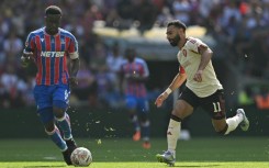 Crystal Palace star Marc Guehi (L) says living with his parents and sisters is the perfect balance to his high pressure career