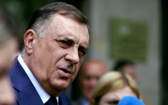 The Bosnian Serb president, Milorad Dodik, is defying a ban on him staying in office, and seeking public support to stay in power