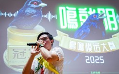 Bob Chan, who took top prize, imitates bird calls for the judges on Saturday