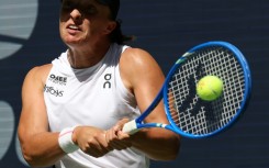Poland's Iga Swiatek blasts a return to Emiliana Arango in a straight sets first round win at the US Open