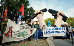 Activists protest against the idea of bringing back compulsory military service, in front of the Defence Ministry in Berlin