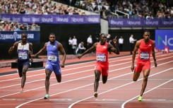 Jamaica's Oblique Seville (2nd R), celebrates as he denies Noah Lyles (2nd L), at the London Diamond League