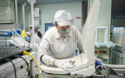 A worker at an assembly line of the Washlet Techno factory of Japanese toilet manufacturer TOTO in To