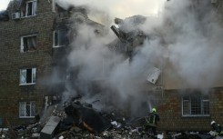 The attack -- one of the deadliest on Kyiv -- blasted a five-storey crater in one apartment block, ripping the building in two