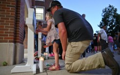 A vigil was held in Minneapolis for a church shooting in which two children were killed and 18 other people were injured