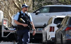 A tow truck removes a car after it was driven into the gates of the Russian consulate in Sydney on September 1, 2025