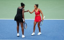 Venus Williams (left) celebrates a point with Leylah Fernandez during their US Open doubles defeat to top seeds Taylor Townsend and Katerina Siniakova