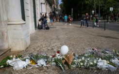People have been leaving flowers and tributes to the victims at the site of the crash