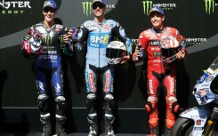 Pole position winner BK8 Gresini Racing MotoGP team's Spanish MotoGP rider Alex Marquez with Fabio Quartararo and his brother Marc Marquez