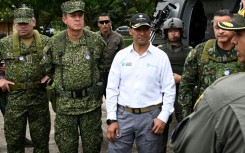 Colombian Defense Minister Pedro Sanchez tours a coca eradication program on Colombia's restive border with Ecuador