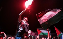 Tunisian protesters shout anti-Israeli slogans and wave Palestinian flags at the Port of Sidi Bou Said near Tunis on September 9, 2025