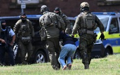 Officials said after the attack that two men and a woman were killed by being stabbed in the neck