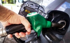 A man fills up his car at a gas station in Moscow on September 8, 2025