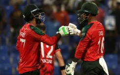 Bangladesh captain Litton Das (R) and Towhid Hridoy bump their fists during their Asia Cup win against Hong Kong