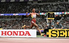 Kenya's Beatrice Chebet celebrates after winning the world 10,000m title