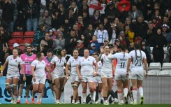 England players celebrate their 40-8 Women's Rugby World Cup quarter-final win over Scotland in Bristol
