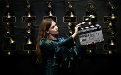 A clapper board used in the production of the film 'Downton Abbey: A New Era', in front of the 'bell wall'