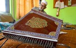 Generations of artisans in Indian-administered Kashmir have been making musical instruments such as the santoor, a zither-like, hundred-stringed instrument