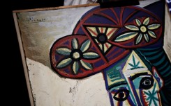 The painting is in a simple wooden frame