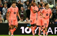 Marcus Rashford takes the acclaim of his Barcelona teammates after scoring one of his two goals against Newcastle United in the Champions League on Thursday