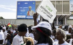 A billboard of Guinea President Mamady Doumbouya is seen during a "yes" vote rally at the People's Palace in Conakry on September 18, 2025