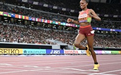 Kenya's Beatrice Chebet crosses the finish line to win the women's 5,000m
