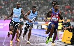 (From L) Botswana's Letsile Tebogo, Botswana's Bayapo Ndori, US' Jacory Patterson and US' Khaleb McRae compete in the men's 4x400m relay final