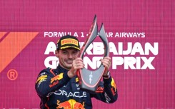 Max Verstappen collects his trophy in Baku