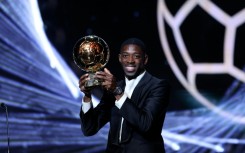 Paris Saint-Germain's Ousmane Dembele with the trophy after winning the men's Ballon d'Or on Monday
